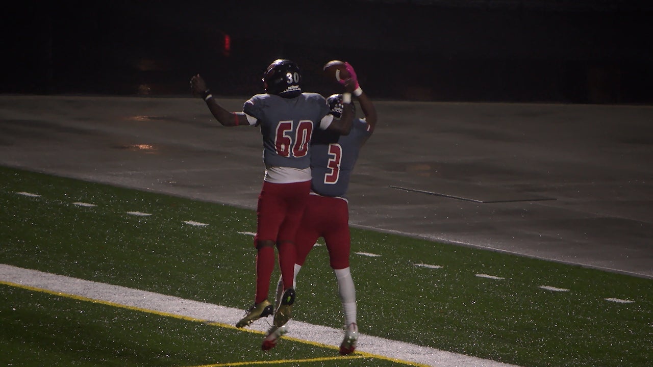 Minneapolis Camden Patriots football team celebrating a playoff victory on the field